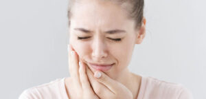 What should I do if complications occur after dental implants?